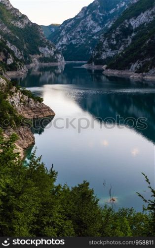 The famous Piva river canyon with its fantastic reservoir Piva Lake (Pivsko Jezero) summer evening view in Montenegro. Nature travel background.