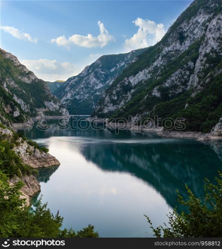 The famous Piva river canyon with its fantastic reservoir Piva Lake (Pivsko Jezero) summer evening view in Montenegro. Nature travel background.