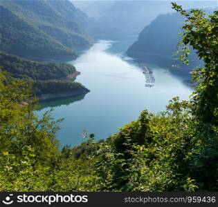 The famous Piva river canyon with its fantastic reservoir Piva Lake (Pivsko Jezero) summer mourning view in Montenegro. Nature travel background.