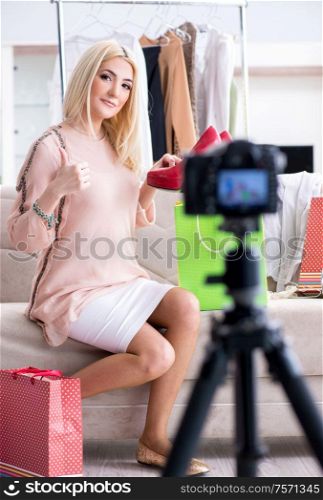 The fashion blogger recording new video for her vlog. Fashion blogger recording new video for her vlog
