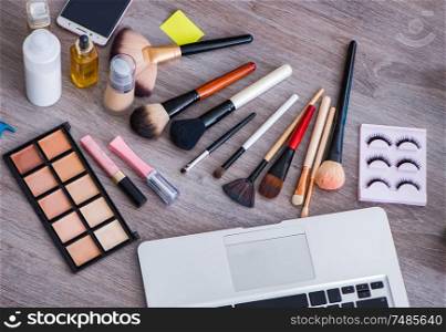 The fashion blogger with make-up accessories. Fashion blogger with make-up accessories