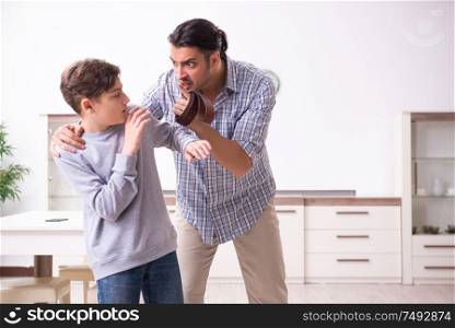 The father beating and punishing his sone. Father beating and punishing his sone