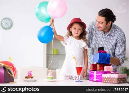 The father celebrating birthday with his daughter. Father celebrating birthday with his daughter
