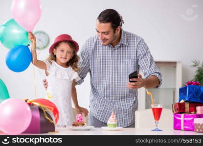 The father celebrating birthday with his daughter. Father celebrating birthday with his daughter