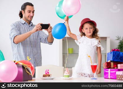 The father celebrating birthday with his daughter. Father celebrating birthday with his daughter