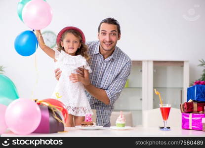 The father celebrating birthday with his daughter. Father celebrating birthday with his daughter