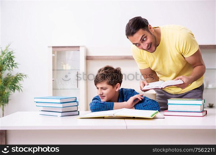 The father helping his son to prepare for school. Father helping his son to prepare for school