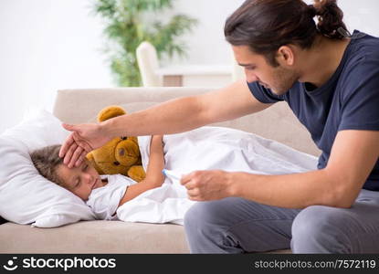 The father taking care of his ill daughter. Father taking care of his ill daughter