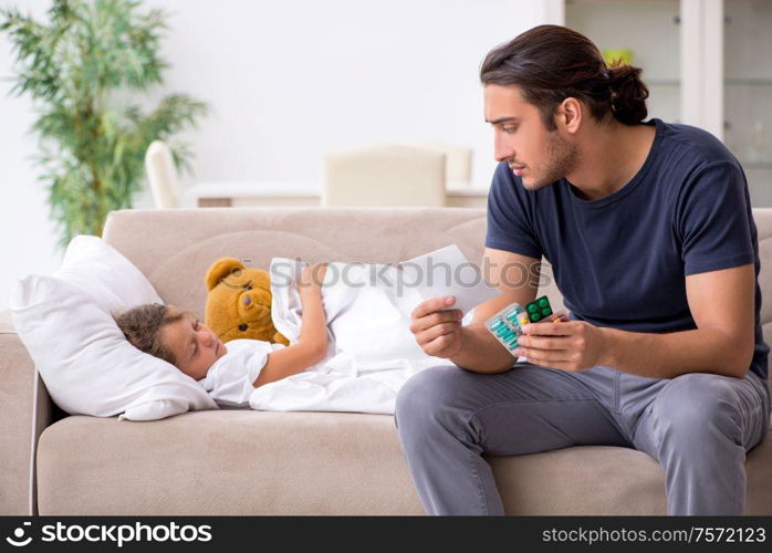 The father taking care of his ill daughter. Father taking care of his ill daughter