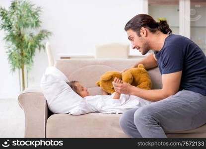 The father taking care of his ill daughter. Father taking care of his ill daughter