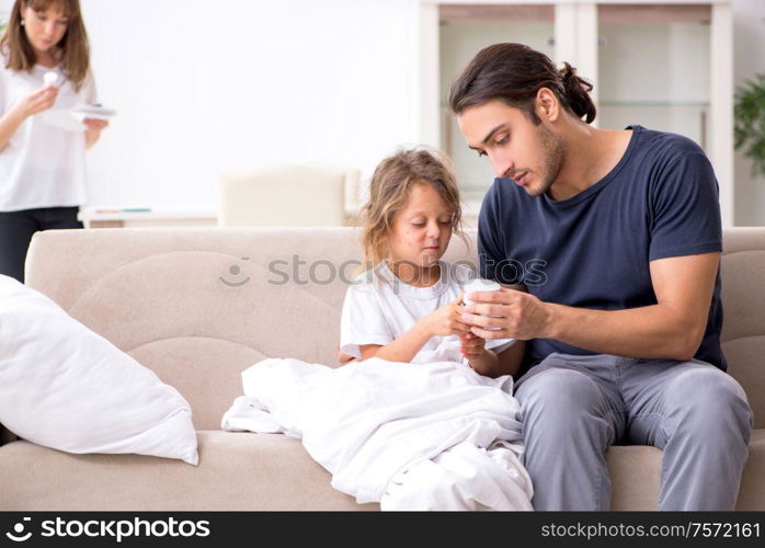 The father taking care of his ill daughter. Father taking care of his ill daughter