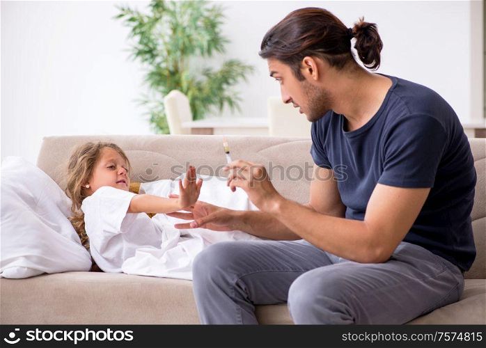The father taking care of his ill daughter. Father taking care of his ill daughter