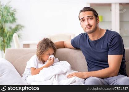 The father taking care of his ill daughter. Father taking care of his ill daughter