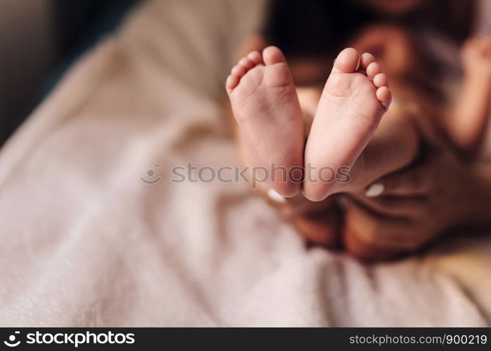 the feet of a small child. the feet of a small child. Newborn's little fingers. cute little baby feet