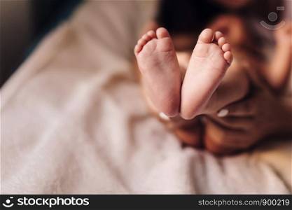 the feet of a small child. the feet of a small child. Newborn's little fingers. cute little baby feet