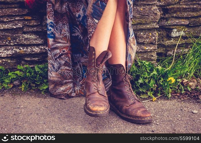 The feet of a woman relaxing in rural environment