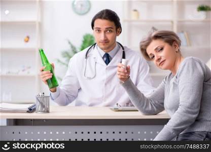 The female alcoholic visiting young male doctor . Female alcoholic visiting young male doctor