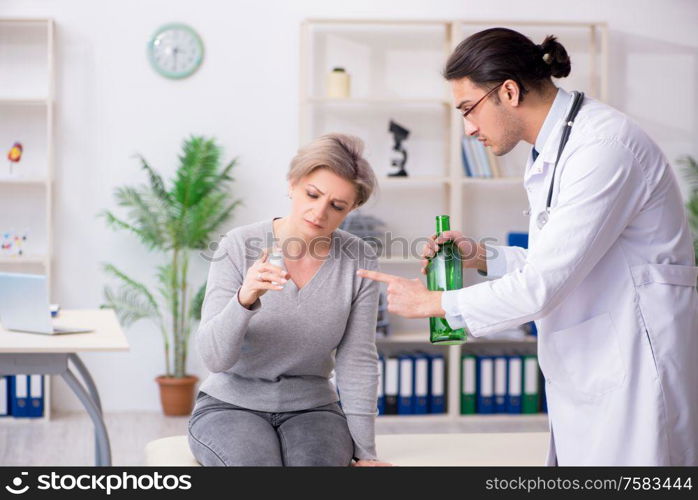 The female alcoholic visiting young male doctor. Female alcoholic visiting young male doctor