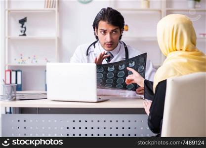 The female arab patient visiting male doctor. Female arab patient visiting male doctor