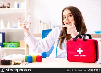 The female beautiful doctor with first aid bag. Female beautiful doctor with first aid bag