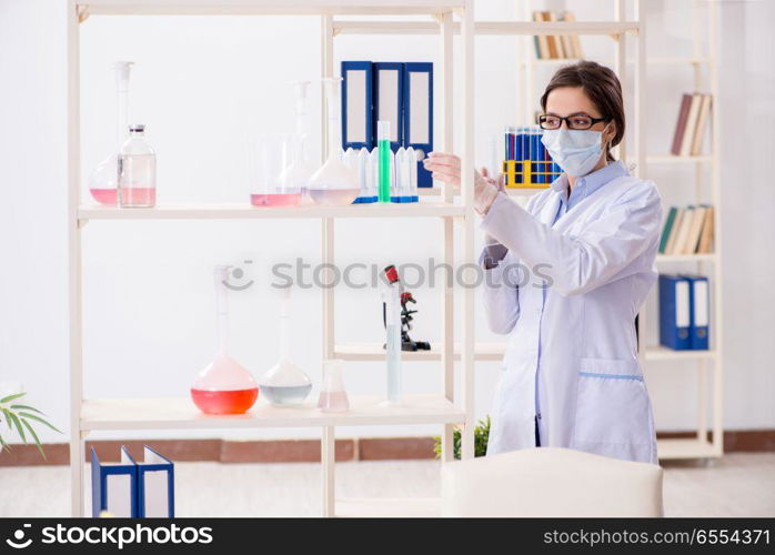 The female chemist working in hospital lab. Female chemist working in hospital lab