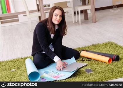 The female designer working in the office . Female designer working in the office 