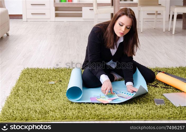 The female designer working in the office. Female designer working in the office