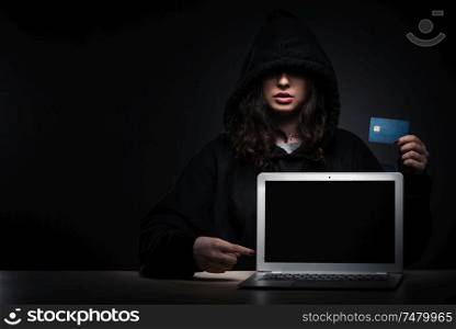 The female hacker hacking security firewall late in office . Female hacker hacking security firewall late in office