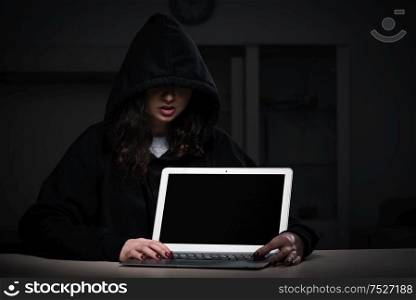 The female hacker hacking security firewall late in office. Female hacker hacking security firewall late in office