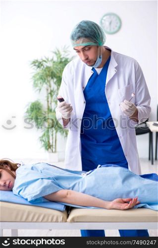 The female patient getting an injection in the clinic. Female patient getting an injection in the clinic