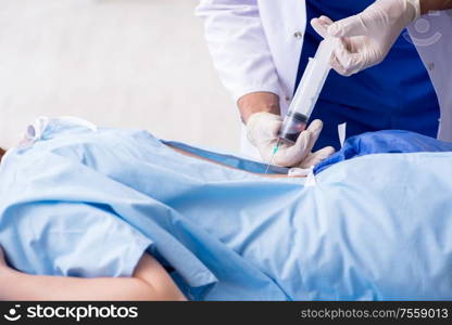 The female patient getting an injection in the clinic. Female patient getting an injection in the clinic