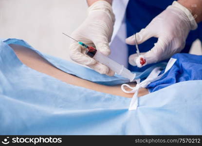 The female patient getting an injection in the clinic. Female patient getting an injection in the clinic