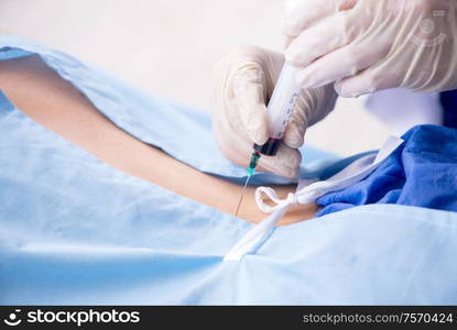 The female patient getting an injection in the clinic. Female patient getting an injection in the clinic