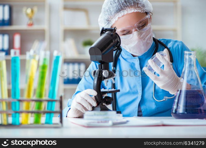 The female scientist researcher doing experiments in laboratory. Female scientist researcher doing experiments in laboratory