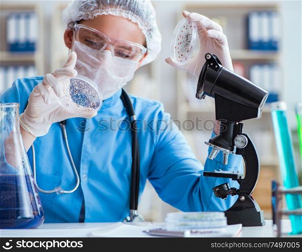 The female scientist researcher doing experiments in laboratory. Female scientist researcher doing experiments in laboratory
