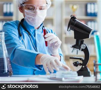 The female scientist researcher doing experiments in laboratory. Female scientist researcher doing experiments in laboratory