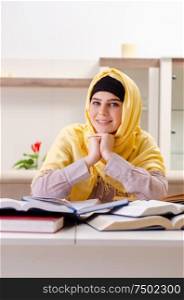 The female student in hijab preparing for exams. Female student in hijab preparing for exams