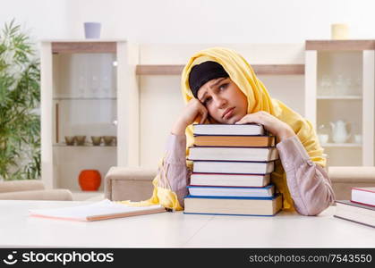 The female student in hijab preparing for exams. Female student in hijab preparing for exams