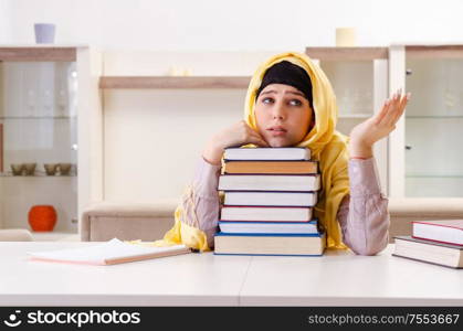 The female student in hijab preparing for exams. Female student in hijab preparing for exams