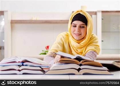 The female student in hijab preparing for exams. Female student in hijab preparing for exams