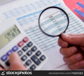 The finance analyst looking and financial reports. Finance analyst looking and financial reports