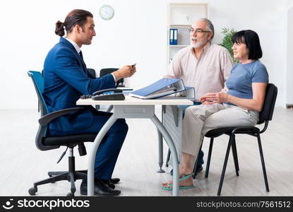 The financial advisor giving retirement advice to old couple. Financial advisor giving retirement advice to old couple