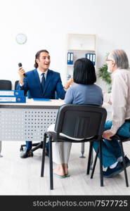 The financial advisor giving retirement advice to old couple. Financial advisor giving retirement advice to old couple