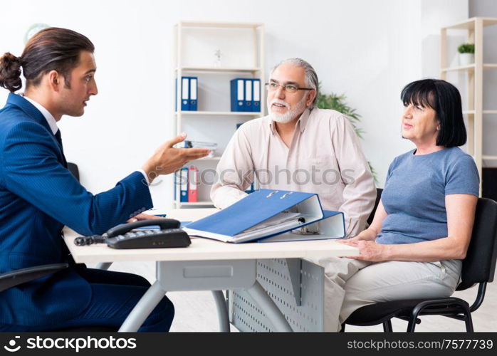 The financial advisor giving retirement advice to old couple. Financial advisor giving retirement advice to old couple