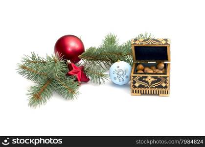 the fir-tree branch decorated with spheres and casket with forest nutlets, isolate, a subject holidays Christmas and New Year