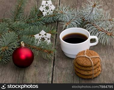the fir-tree branches decorated with an ornament, coffee baking and snowflakes, a subject holidays Christmas and New Year