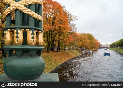 The first garden bridge of the Moika river, Mikhailovsky Park .Autumn landscape, St. Petersburg .. Detail Of the first garden bridge of the Moika river, Mikhailovsky Park .Autumn landscape, St. Petersburg .