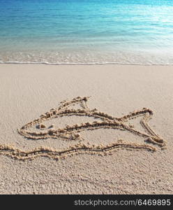 The fish - a picture on sand