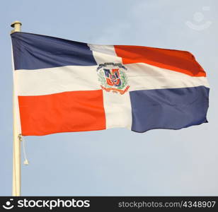 The flag of the Dominican Republic flying over Doha, Qatar, during an international conference.
