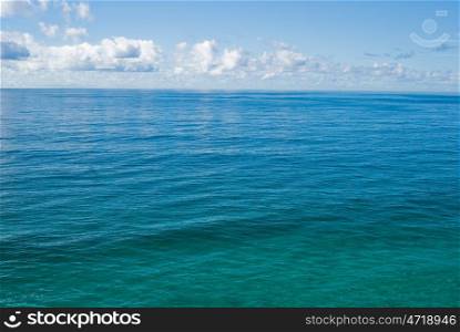 the flat and calm deep blue tropical ocean. the tropical ocean